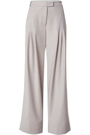 REMAIN Pantaloni con pieghe