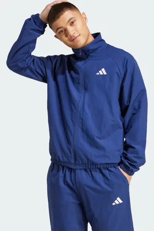 adidas Giacca a vento essenziale con logo piccolo