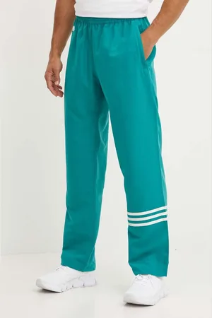 adidas Pantaloni della tuta colore con applicazione JF9159