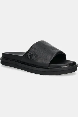 Calvin Klein Ciabatte slide FLAT MOLDED SLIDE SANDAL LTH uomo colore YM0YM01225