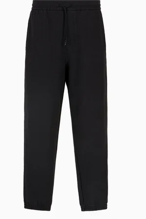 Emporio Armani Pantaloni jogger in jersey misto lyocell lettering all over ASV