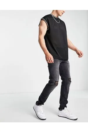 ASOS Jeans slim elasticizzati slavato con strappi sulle ginocchia