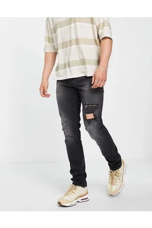 ASOS Jeans slim stretch slavato con strappi