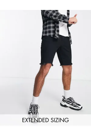 ASOS Pantaloncini di jeans slim neri con fondo grezzo