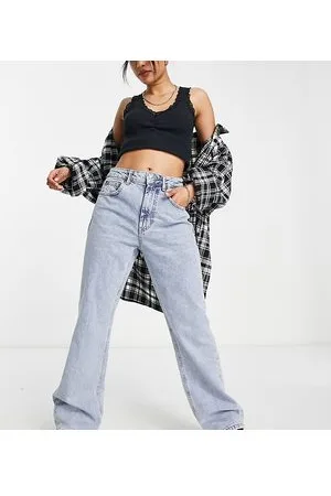 Stradivarius Petite - Jeans a zampa vintage azzurri