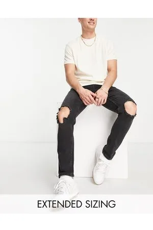 ASOS Jeans slim elasticizzati slavato con strappi sulle ginocchia