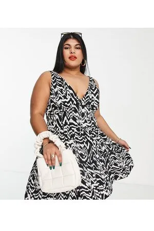 ASOS ASOS DESIGN Curve - Prendisole a balze nero e crema con stampa astratta e bottoni in vita