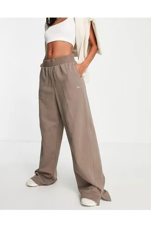 Reebok Pantaloni a vita alta con fondo ampio color talpa