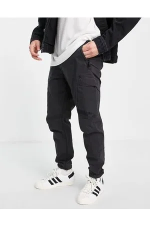 River Island Pantaloni cargo neri slavati con tasche