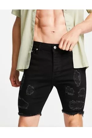 Bolongaro Pantaloncini skinny in denim slavato con strappi