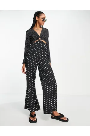 Lola May Tuta jumpsuit a fondo ampio a pois con cut-out