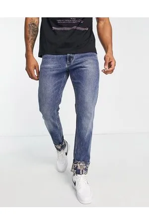 VERSACE Jeans con toppe stile barocco