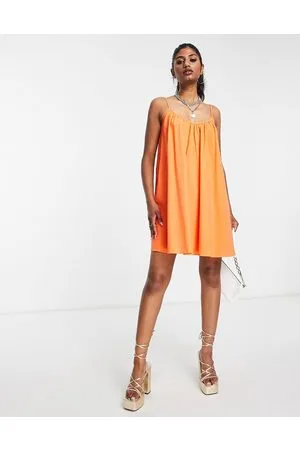 EDITED the label Vestito grembiule corto in cotone acceso con allacciatura sul retro