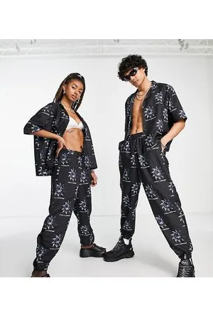 COLLUSION Unisex - Noughties - Joggers neri stampati in coordinato