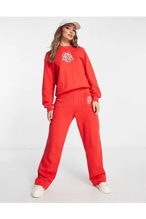Damson Madder Joggers in cotone rossi con fiocco ricamato in coordinato