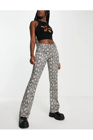 Weekday Pantaloni beige con stampa pitonata