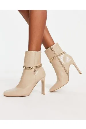 River Island Stivali con tacco color crema con catena