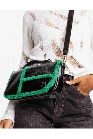 River Island Borsa a tracolla nera con pile borg a contrasto