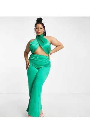 Extro & Vert Plus Tuta jumpsuit allacciata al collo con pantalone palazzo in raso smeraldo