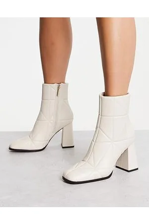 River Island Stivali crema trapuntati con tacco largo