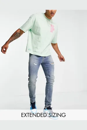 ASOS Jeans skinny lavaggio medio con strappi