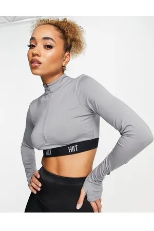 HIIT Top con zip corta e fettuccia con logo