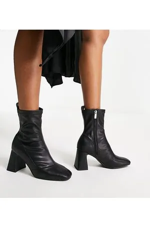 Schuh Bella - Stivali a calza con tacco neri a pianta larga