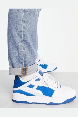 PUMA Slipstream - Sneakers bianche con dettagli in camoscio blu