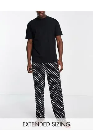 ASOS Pigiama con t-shirt e pantaloni neri con pois bianchi