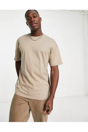 New Look T-shirt oversize chiaro con faccina sorridente ricamata