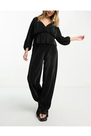 River Island Pantaloni a fondo ampio nero plissé in coordinato