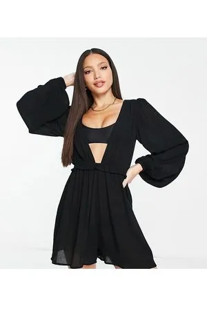 ASOS ASOS DESIGN Tall - Tuta corta a maniche lunghe nera da spiaggia con scollo profondo