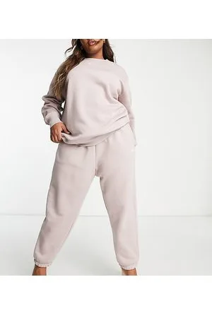 Nike Plus - Phoenix - Joggers color pietra