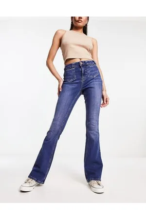 River Island Jeans scuro a vita medio alta con dettaglio a cuore