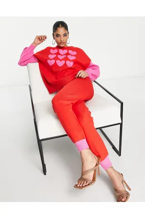 Never Fully Dressed Pantaloni in maglia rosa e rosso a contrasto in coordinato