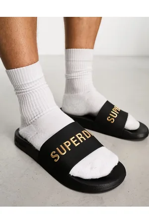 Superdry Code - Sliders da piscina nere vegan-friendly con logo