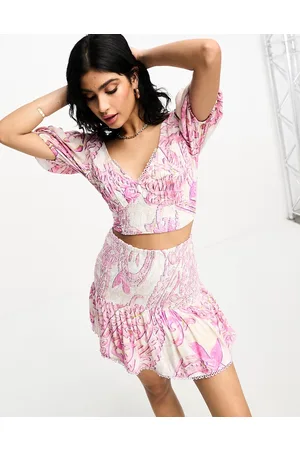 River Island Minigonna da spiaggia arricciata con stampa rosa in coordinato
