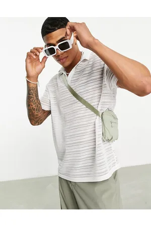 ASOS Polo comoda con rever a coste trasparenti