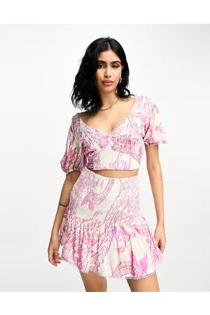 River Island Top da spiaggia arricciato con maniche a sbuffo e stampa rosa in coordinato