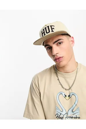 Huf Cappellino beige e marrone con logo ad arco