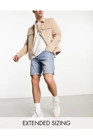 ASOS Pantaloncini di jeans slim ed elasticizzati lunghezza media lavaggio medio