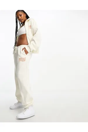 The Couture Club Joggers oversize sporco con logo in coordinato