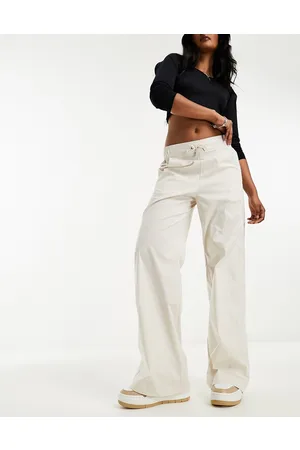 Nike Pantaloni a vita alta marrone legno chiaro con logo piccolo