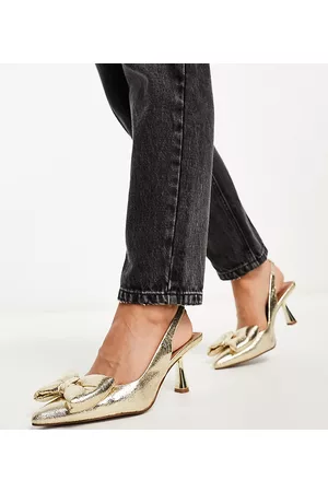 ASOS Wide Fit - Scarlett - Scarpe con tacco medio dorate con fiocco a pianta larga