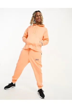 Under Armour Summit - Joggers arancioni in tessuto misto in coordinato