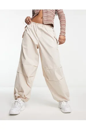 River Island Pantaloni cargo a vita bassa beige stile parachute