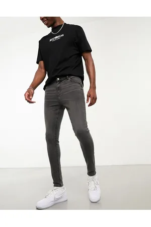 ASOS Jeans in power stretch slavato effetto spray
