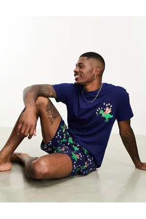 ASOS Completo da casa con stampa natalizia con dinosauri composto da T-shirt e pantaloncini