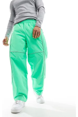 The North Face Tek - Joggers in tessuto acceso con profili a contrasto riflettenti