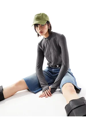 Noisy May Top a maniche lunghe scuro con righe diagonali e zip corta